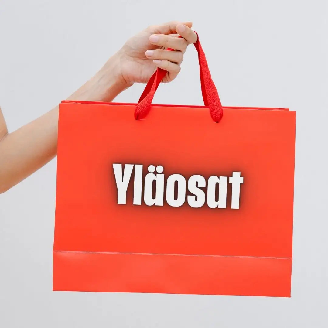 Vilkkaan punainen paperikassien ostoskassi, jossa on samanväriset kahvat ja sana ‘yläosat’ painettuna edessä rohkeilla valkoisilla kirjaimilla.
